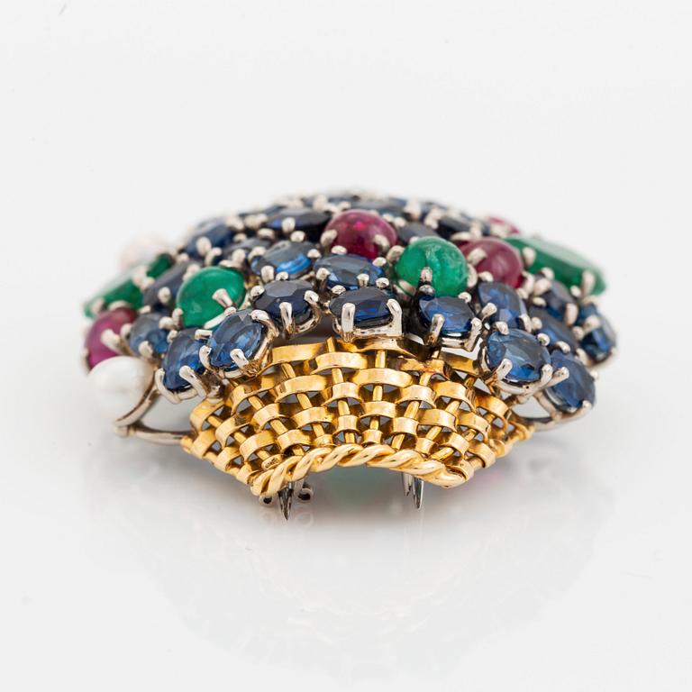 An 18K gold Carlman brooch set with sapphires, emeralds, rubies and pearls.