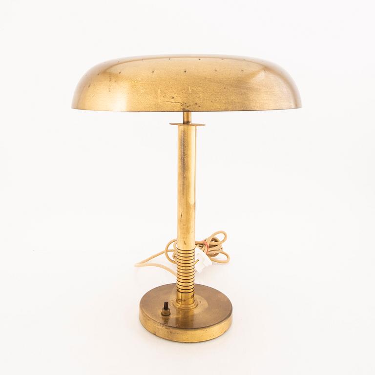 A brass table lamp possibly by Bertil Brisborg, from the mid 20th century.