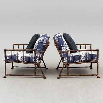 A Pair of contemporary garden easy chairs in metal imitating bamboo.