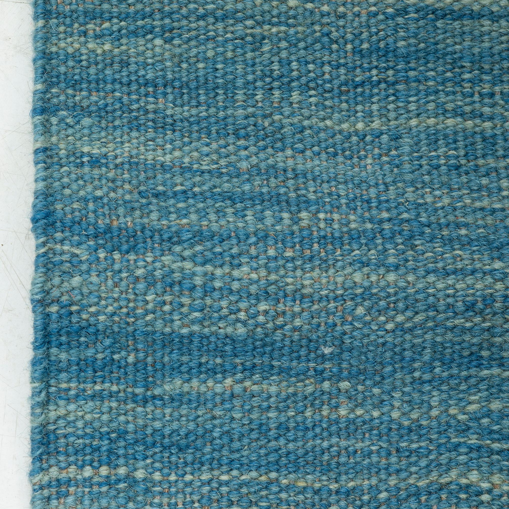 A kilim carpet 244 x 171 cm.