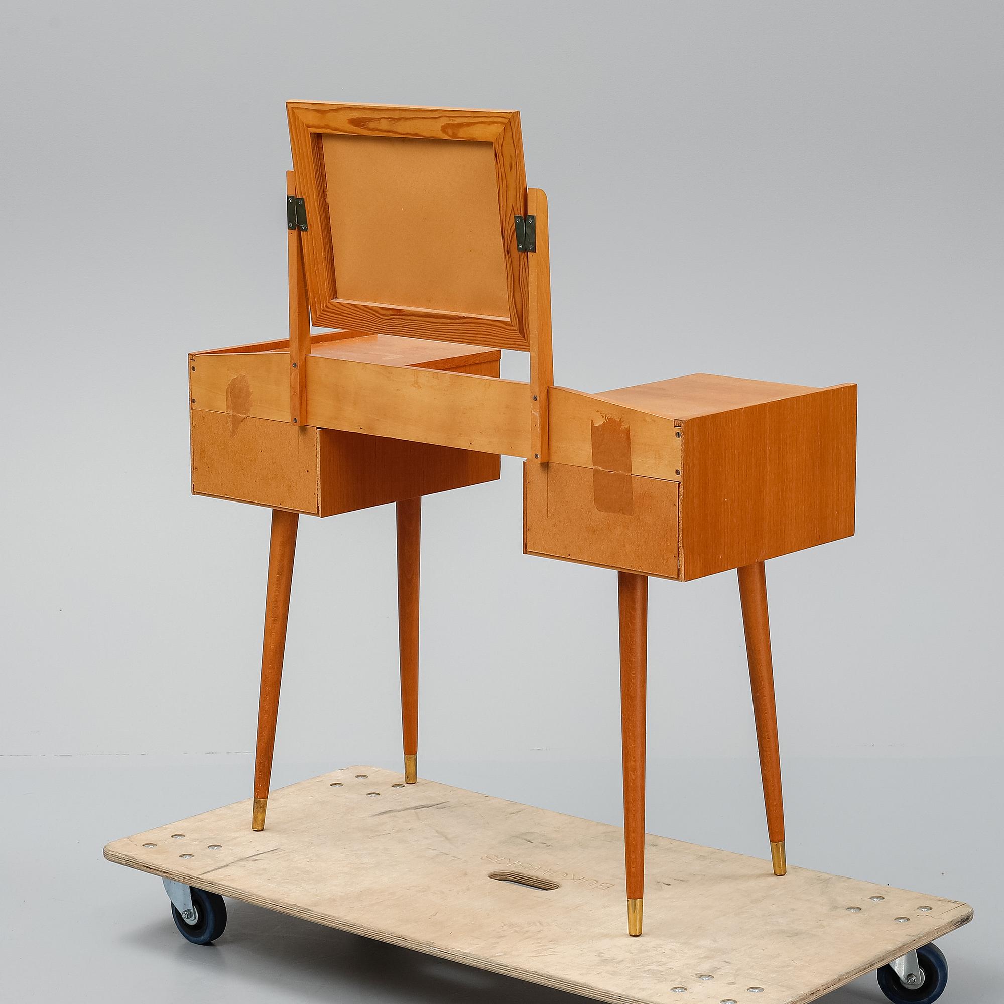 A teak makeup-table from the mid 20th century.
