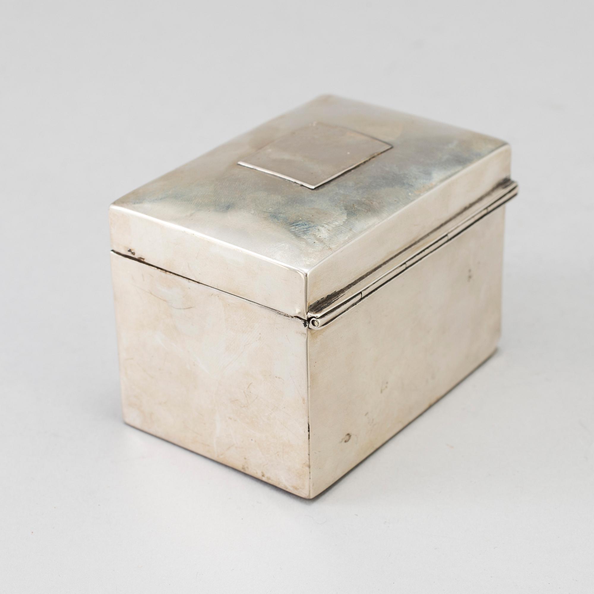A silver calculator by Tiffany's and cuff link box in silver H.V.P & Co Birmingham 1887.