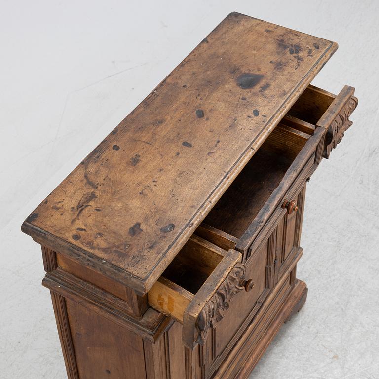 A Baroque style cabinet, circa 1900 with older parts.
