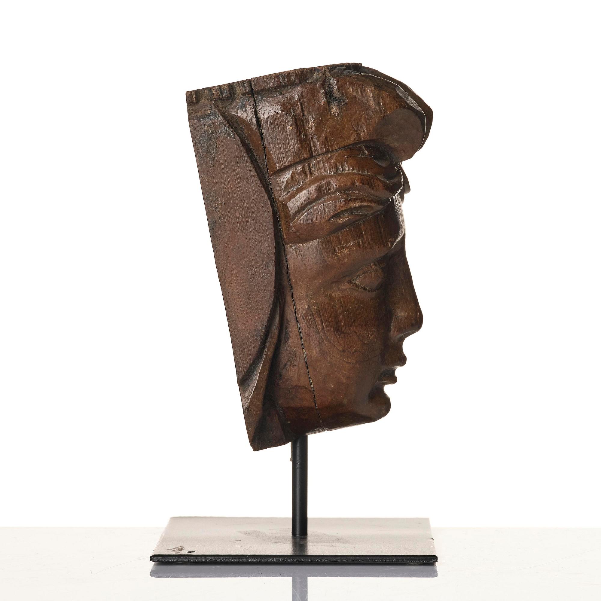 A wooden sculpture presumably Baroque around year 1700.