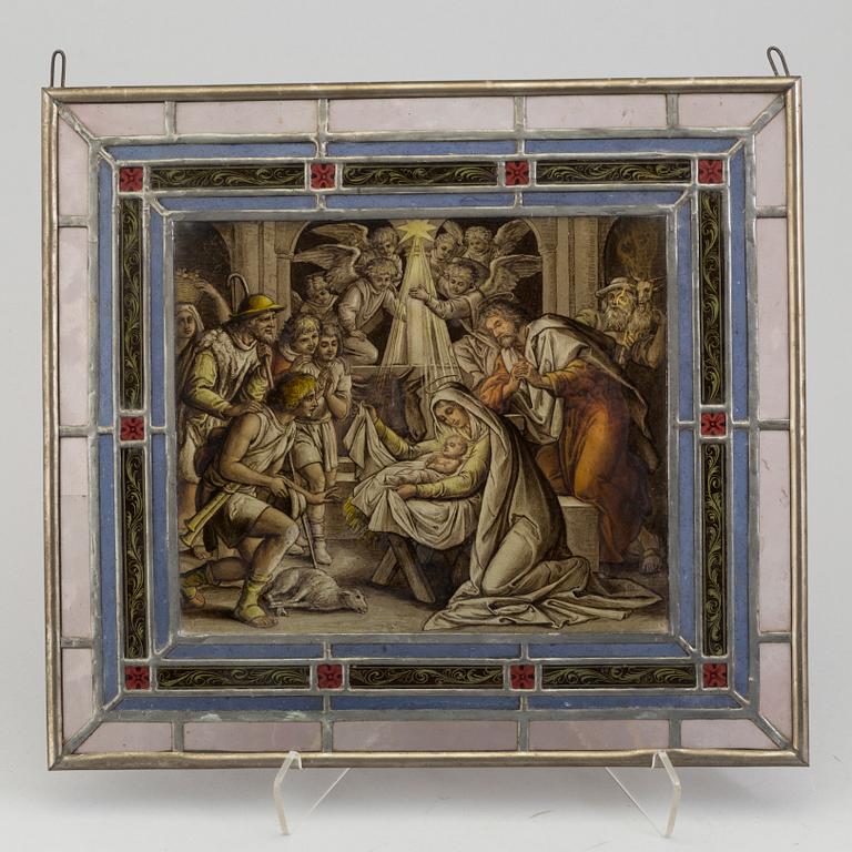 A pair of stained glass windows, circa 1900.