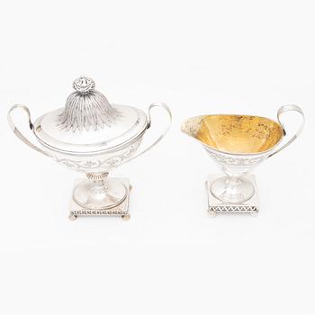 A silver sugarbowl with lid and a creamer, marks of Olof Hellbom, Stockholm, Sweden 1799-1800.