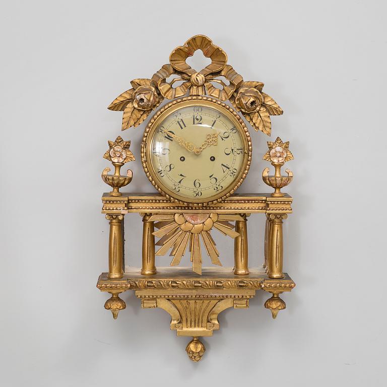 A gustavian style wall clock, first half of the 20th century.