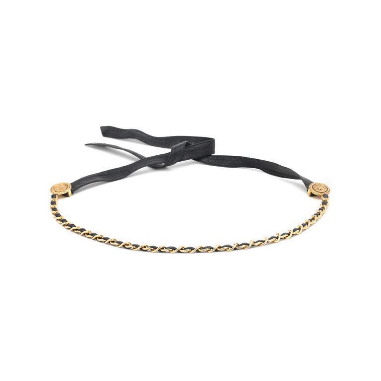 CHANEL, a black leather belt with gold colored metal chain.