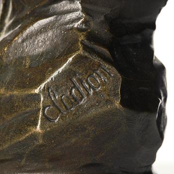 A pair of Louis XVI-style four-light gilt and patinated bronze candelabra after Clodion, later part 18th century.