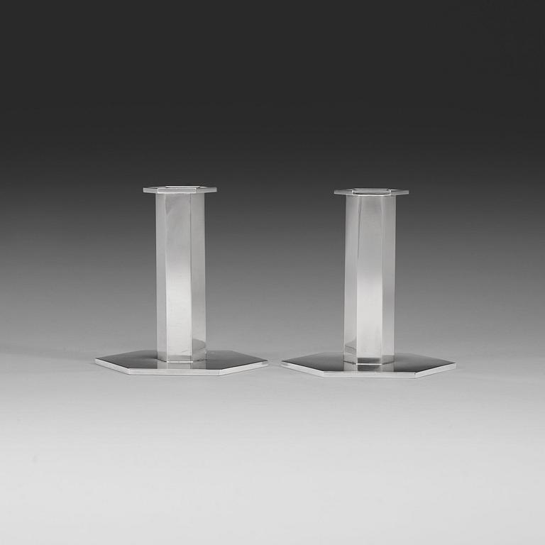 A pair of Wiwen Nilsson sterling candlesticks, Lund 1961 & -67.