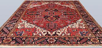 A semi-antique Heris carpet, approx. 343 x 260 cm.