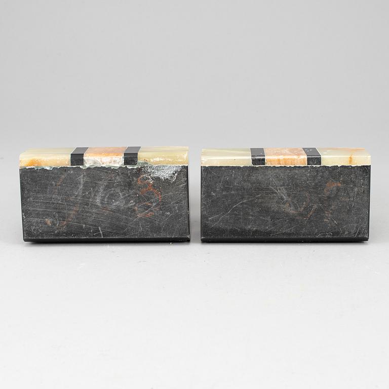 A pair of art déco onyx and marble book ends, 1930s.