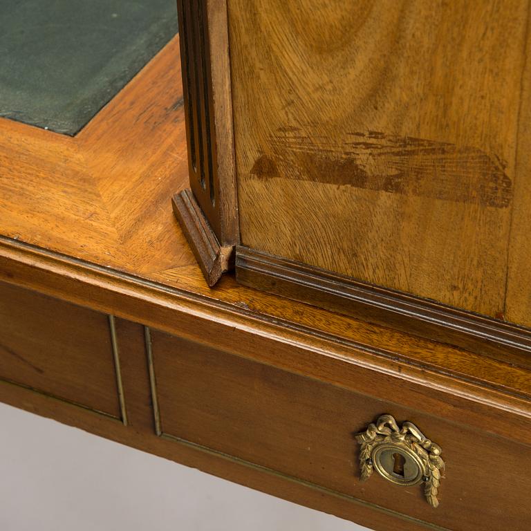 A 20th-century Louis XVI style mahogany veneered writing desk.