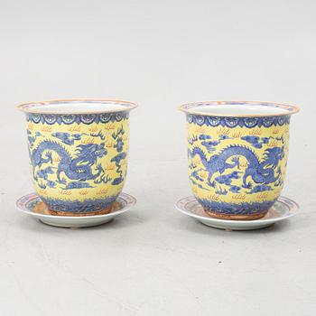 A pair of porcelain palnters with stands, China, 20th Century.
