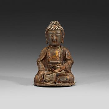 463. A bronze figure of a seated Buddha, late Ming dynasty (1368-1644).