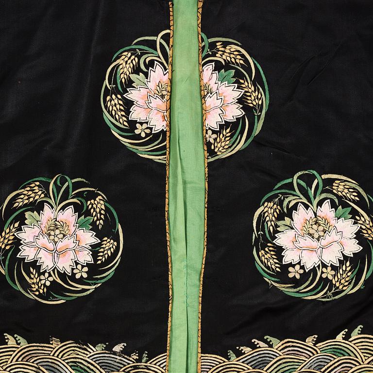 A Chinese embroidered silk robe, height 68 cm, 1920s.