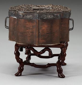 A gilt bronze Sinotibetan figure of Amitayus with a reliquary, 17/18th Century.