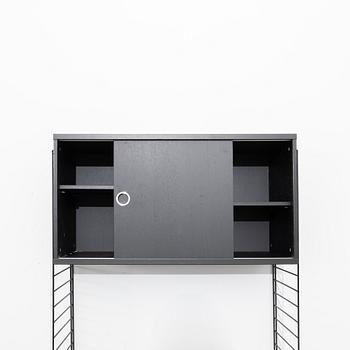 Nils Strinning, Hyllsystem.