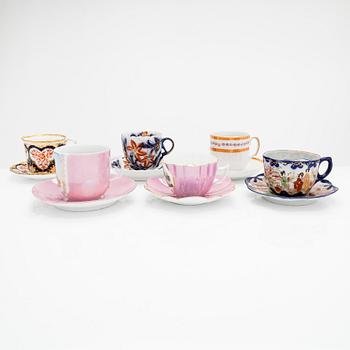 A set of 12 pair of porcelain mustache cups, including Germany, 19th and 20th century.