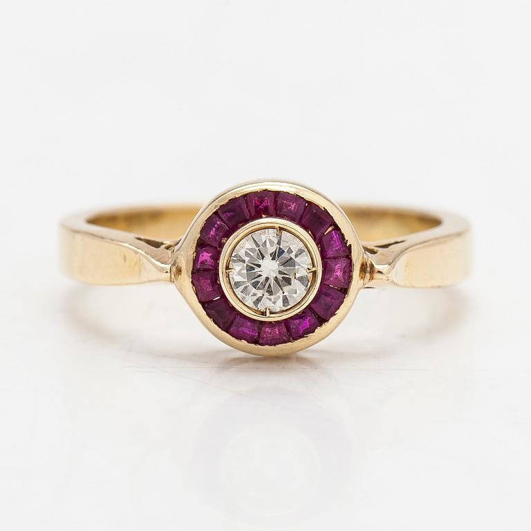 A 14K gold ring with a diamond ca. 0.23 ct and rubies.