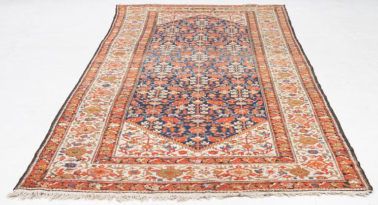 An antique Malayer carpet, west persia c 402 x 178 cm.