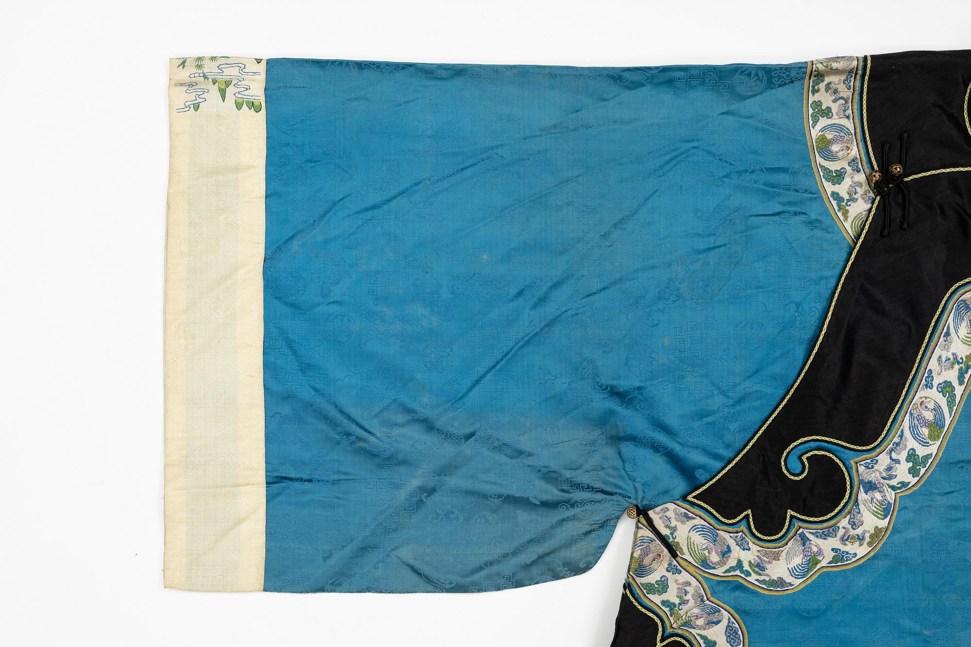 A female silk robe/over coat for winter, Qing dynasty, 19th century.