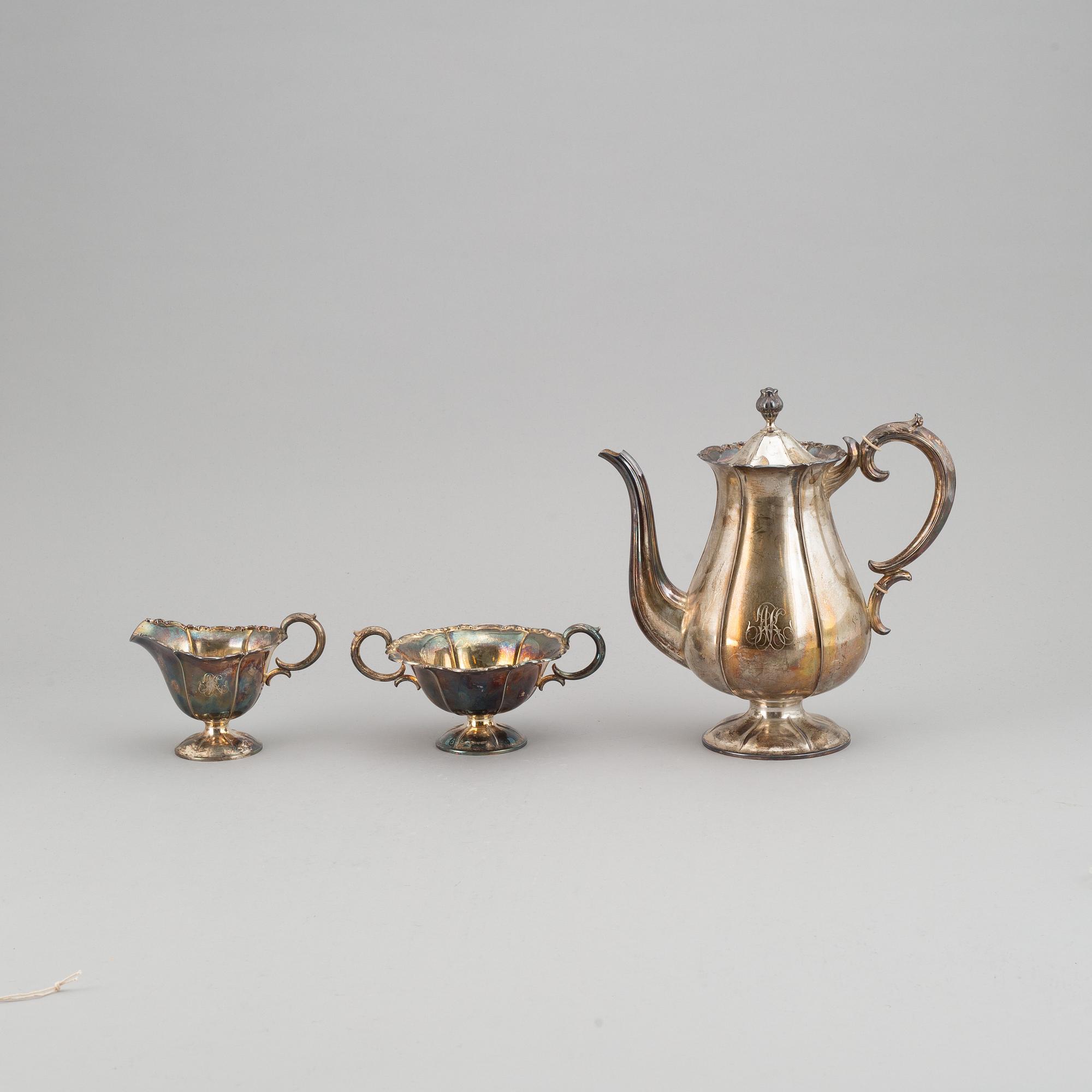 A silver coffee pot, creamer and sugar bowl. Kultakeskus Oy, Hämeenlinna, Finland 1943.