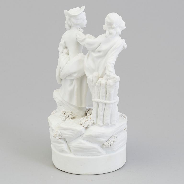 A French bisquit figure of a young couple, Paris, presumably late 18th Century.