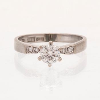 An 18K white gold ring set with round brilliant cut diamonds by Lundberg Guldatelje Amie Stockholm 1977.