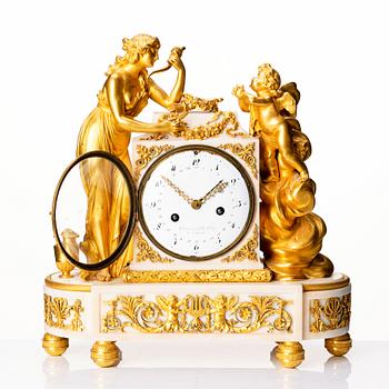 A Louis XVI marble and ormolu mantel clock, late 18th century.