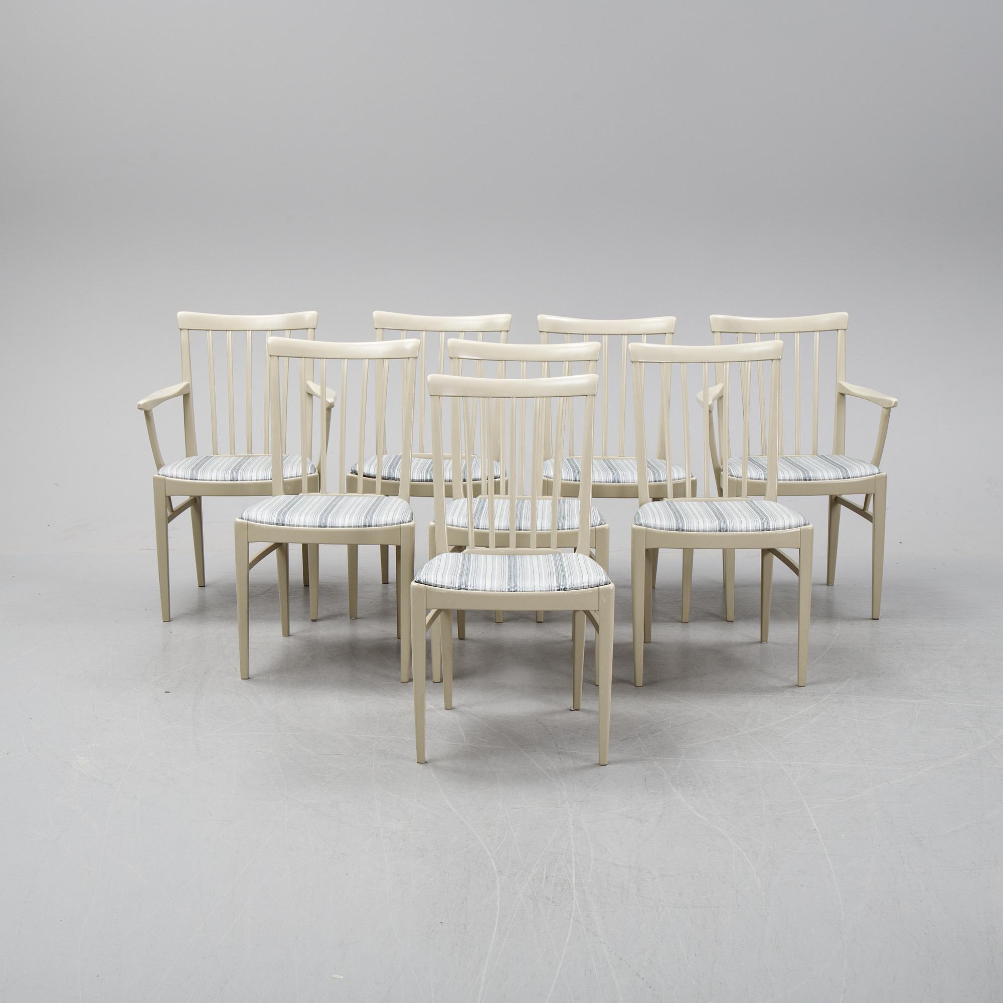 A dining table with two armchairs and six chairs by Carl Malmsten for Bodafors.