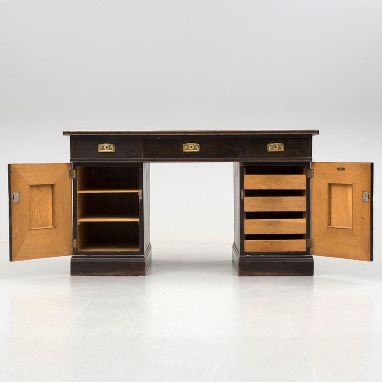 An early 1900s oak writing desk.