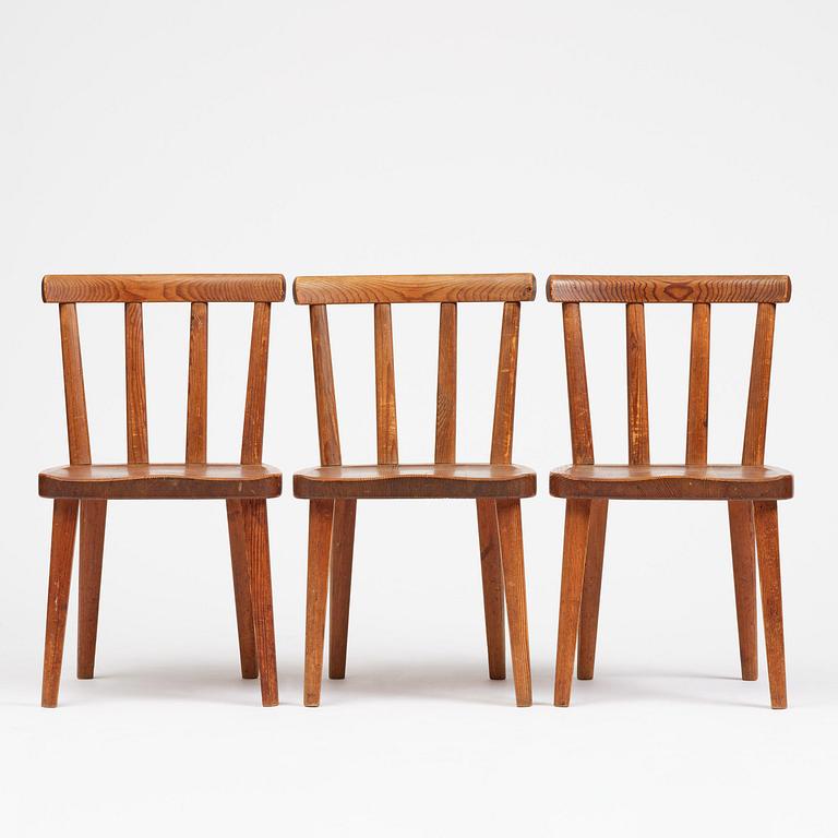 Axel Einar Hjorth, a set of three stained pine "Utö" chairs, Nordiska Kompaniet, Sweden, 1930s.