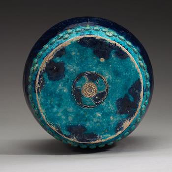 A turkoise and purple glazed garden seat, Ming dynasty, 17th Century.