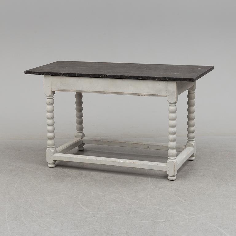 A 19/20th century stone top baroquestyle table.