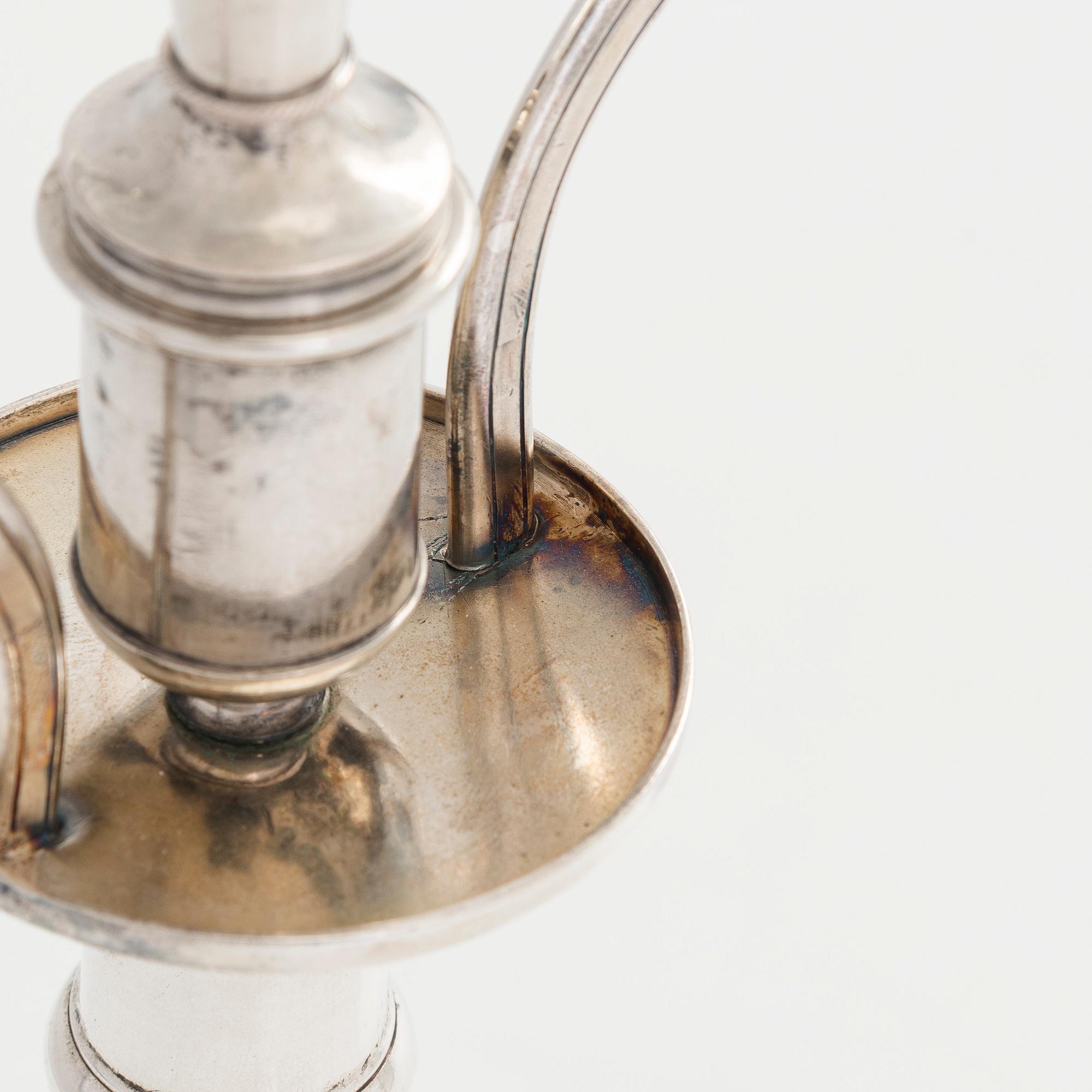 A pair of silver candelabra by Ferdinand Christian Krebs, Breslau, 1776-1792, with snuffers from Reval. Neo-classicism.