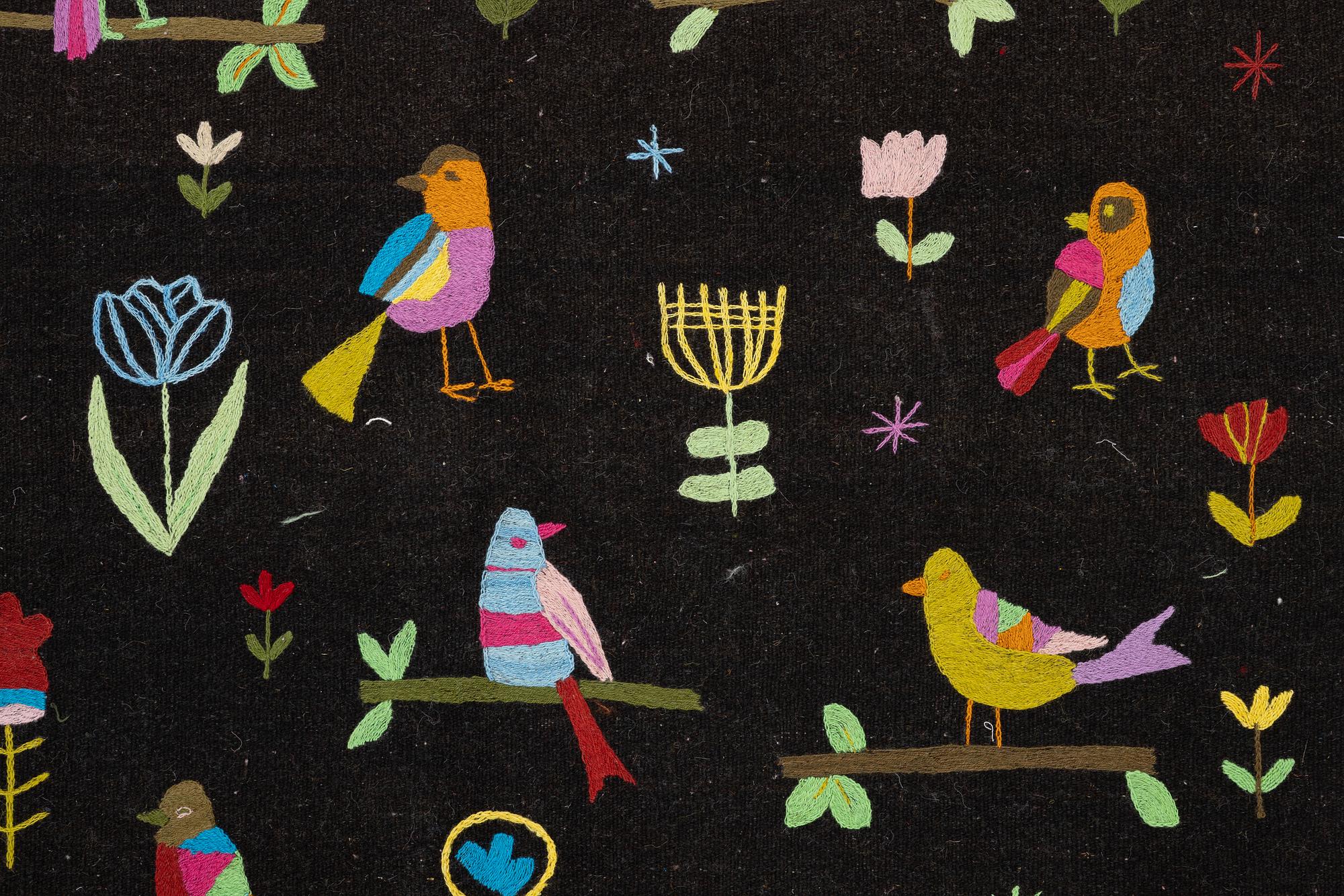 A hand-embroidered Kelim rug, 204 x 150 cm.