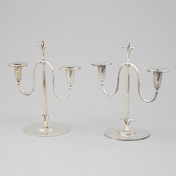 a pair of Elis Bergh silver plated candelabras, Swedish grace, CG Hallberg, Stockholm, 1920s.