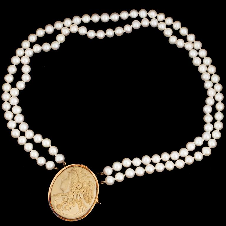 Lava cameo and cultured pearl necklace.