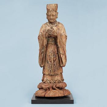 A wooden sculpture of a deity, Ming style.