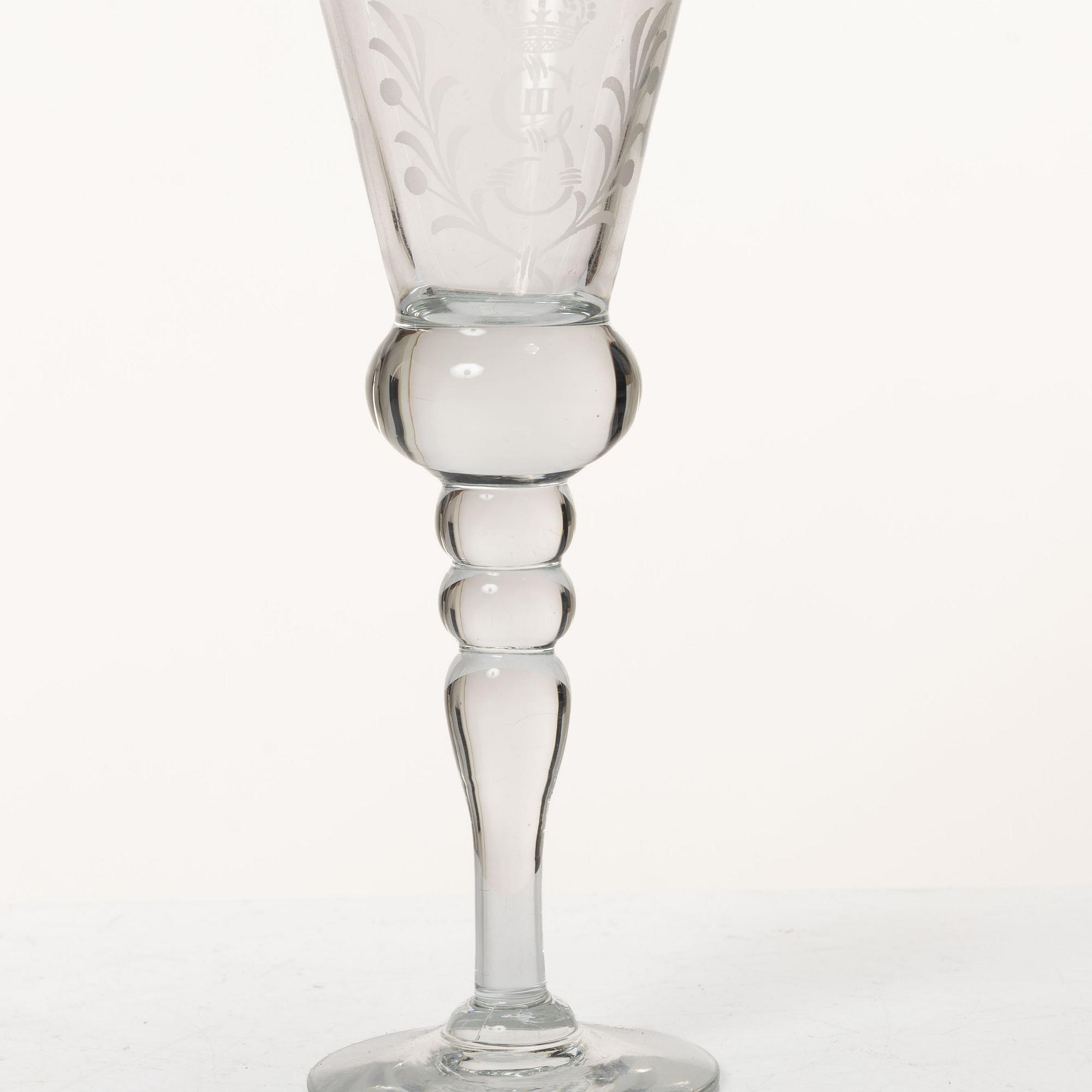 A set of 12 schnaps glasses by Reijmyre Glassworks with king Gustav III emblem.