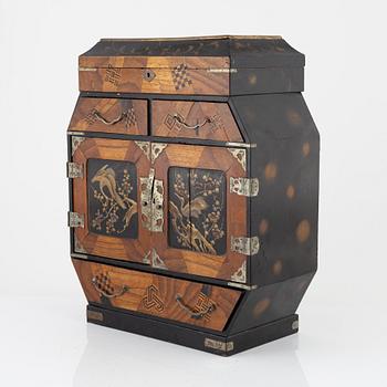 A Japenese partially lacquered hanging cabinet, early 20th century.