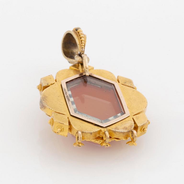 A 19th century 14K gold pendant with a hardstone cameo.