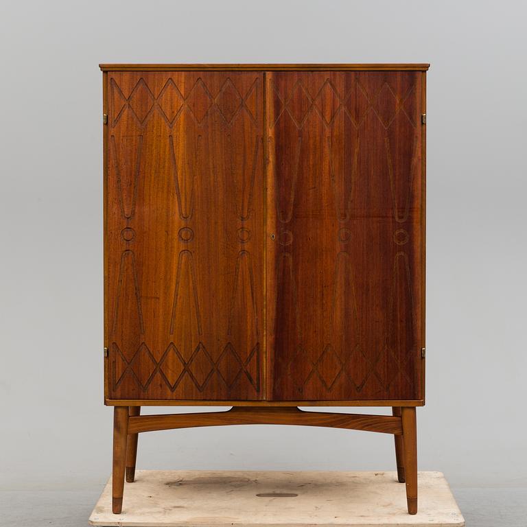A cabinet veneered with teak designed by Kirke Nielsen for Abrahamssons Möbelfabrik in Smålands Taberg, 1950´s.
