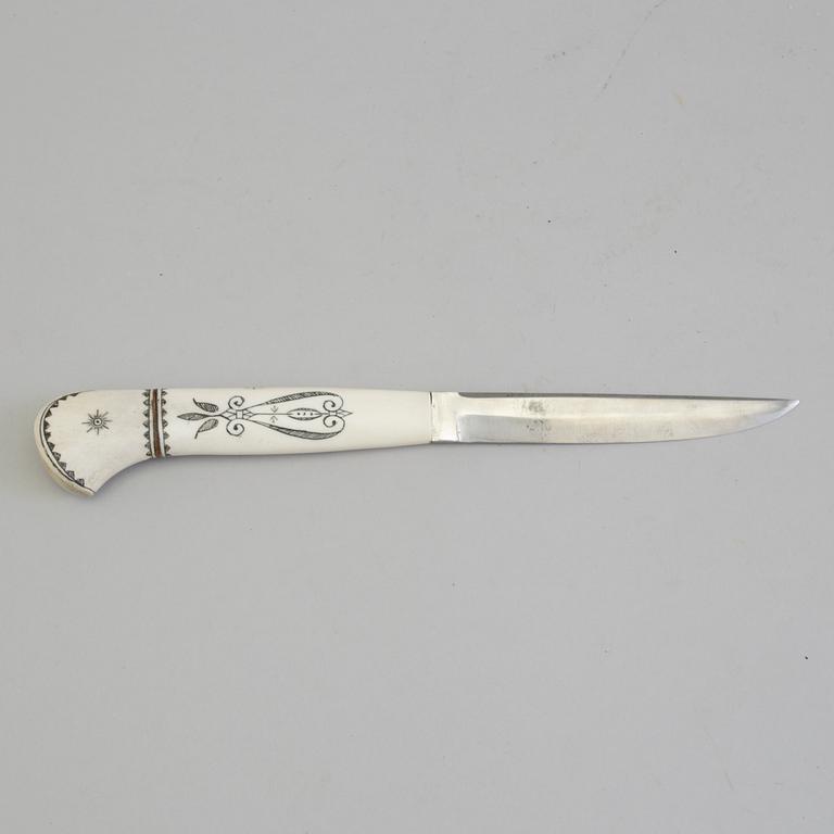 ANTON ENARSSON, a Sami reindeer horn knife, signed AE.