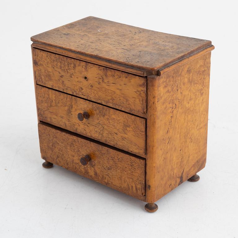 A Swedish miniature commode, 19th century.