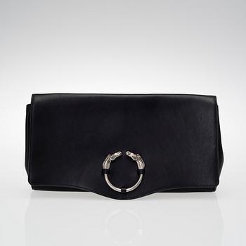 A LEATHER RIBOT HORSE HEAD CLUTCH.