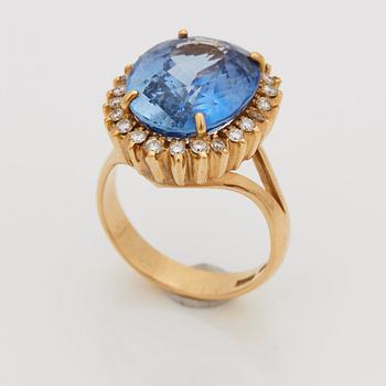 A RING set with a faceted sapphire.