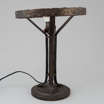 A wrought iron table light, early 20th Century.