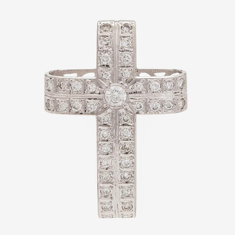An 18K white gold cross pendant with diamonds.